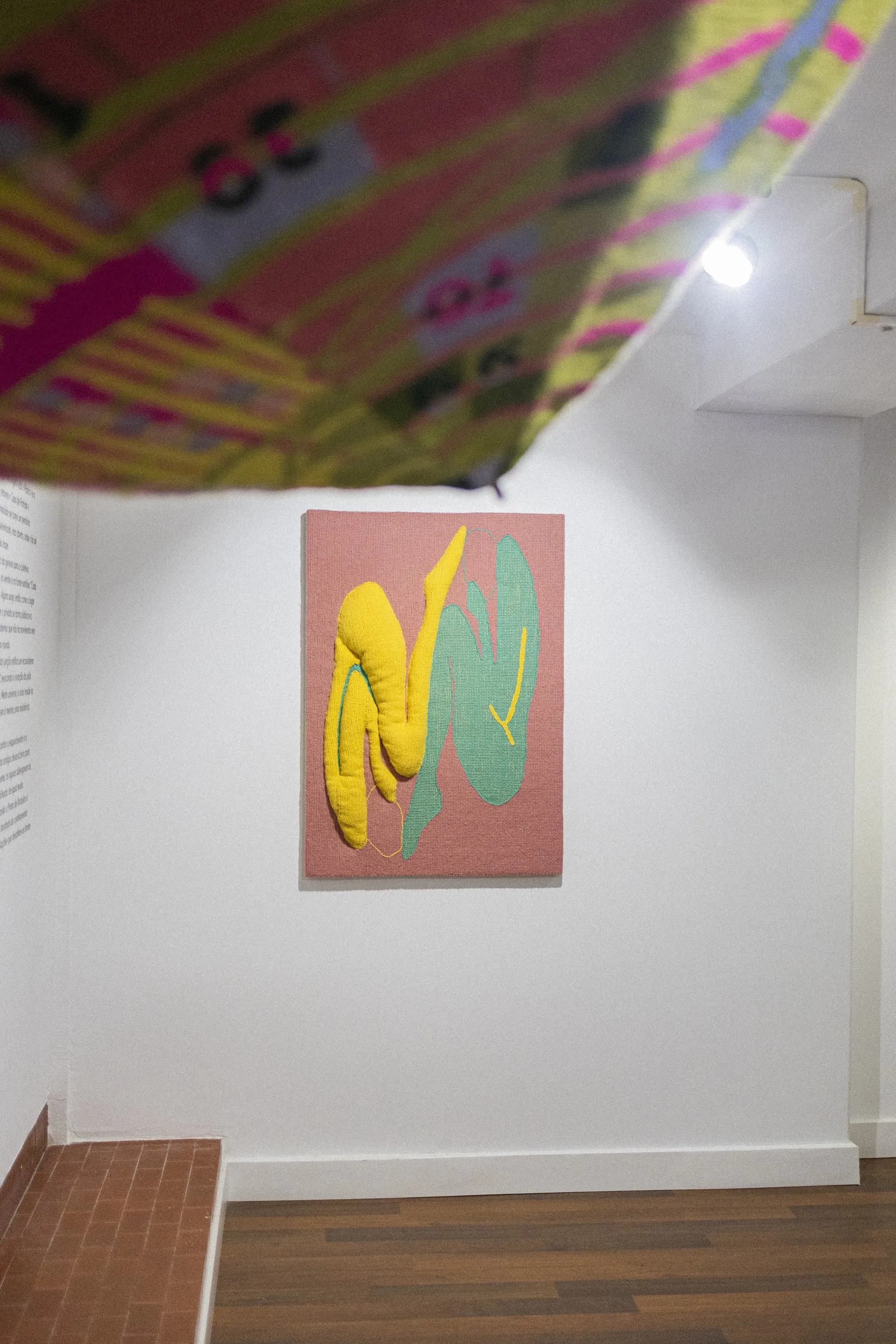 Installation view of ÁGORA with textile works in the gallery