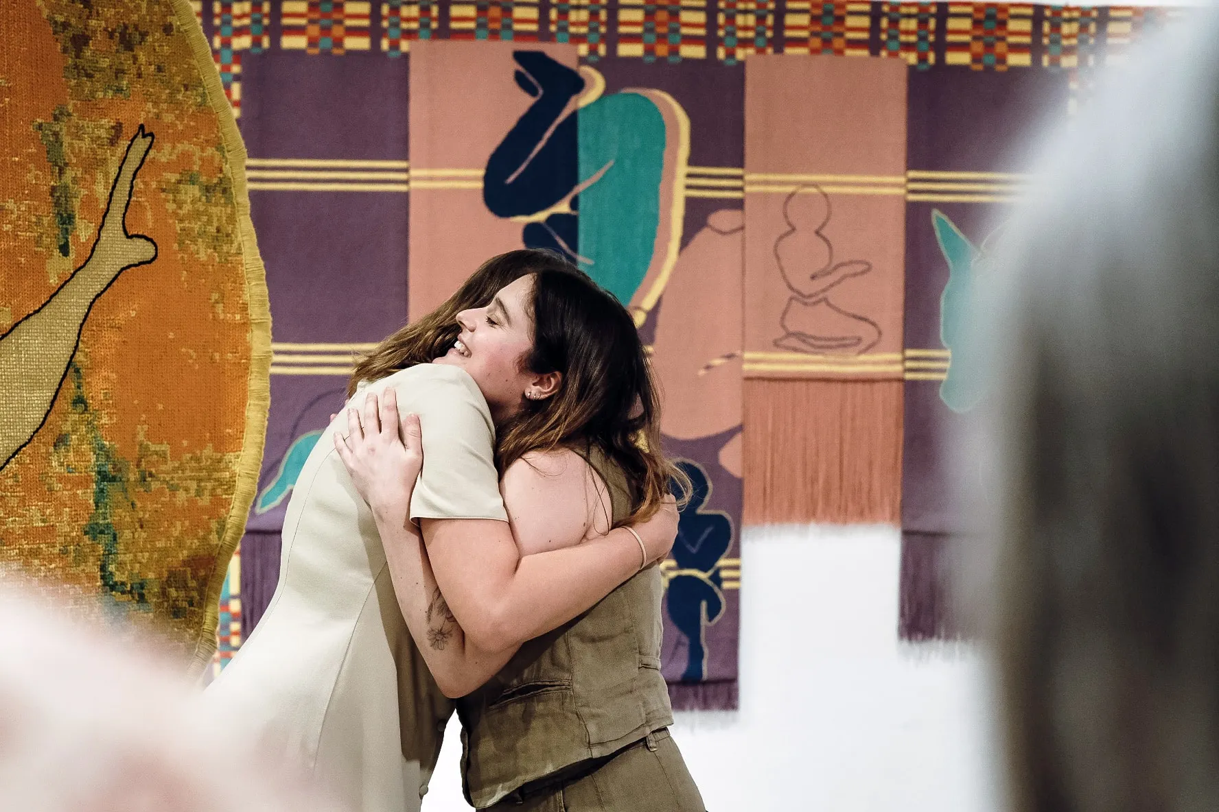 Encounter in the gallery during the Kranj residency, surrounded by textile works.