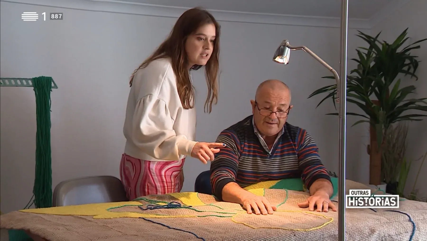 Susana Cereja and Carlos André working together on a textile piece in the studio.