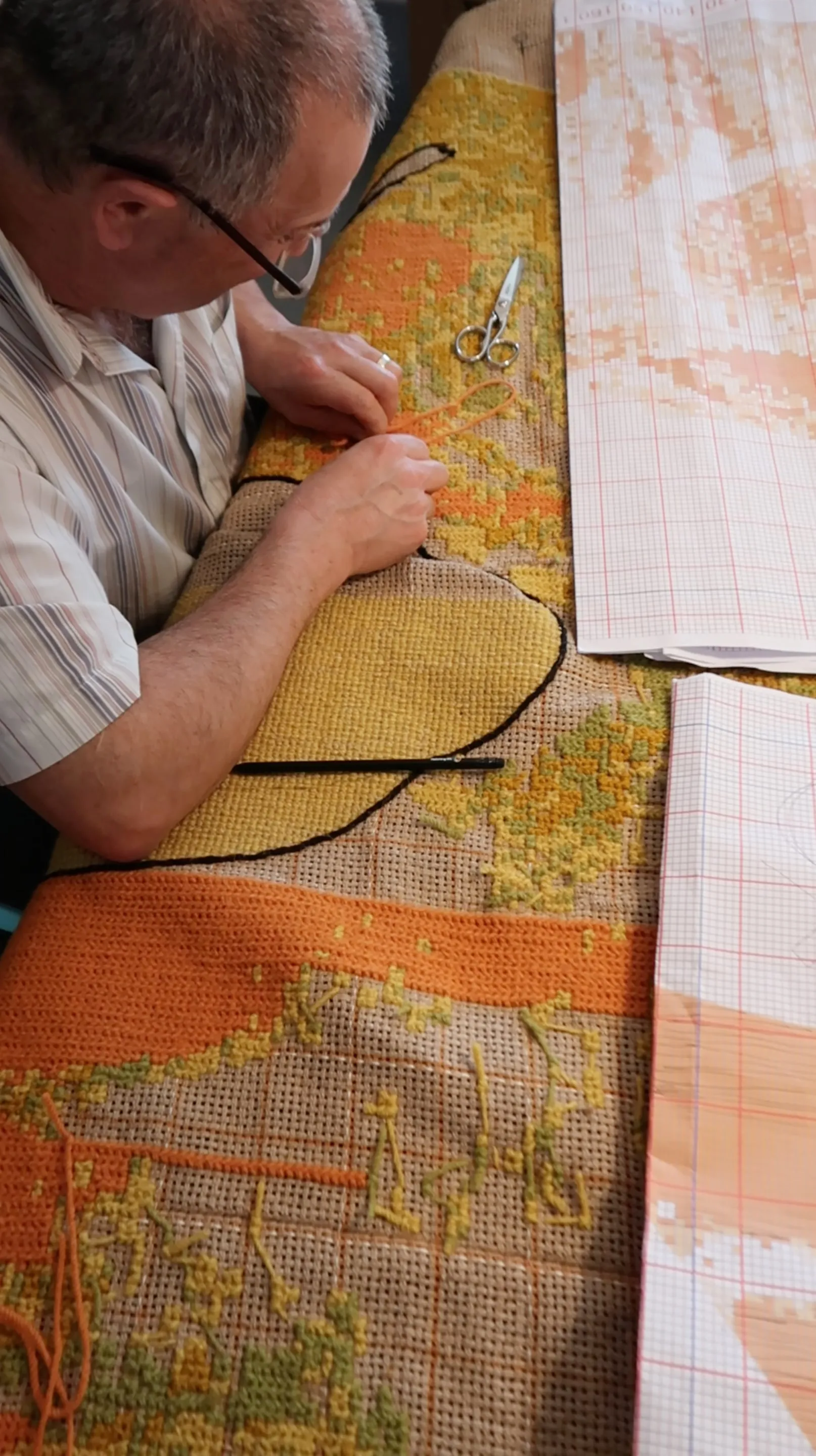 Close view of Arraiolos-stitch work in progress during the residency.