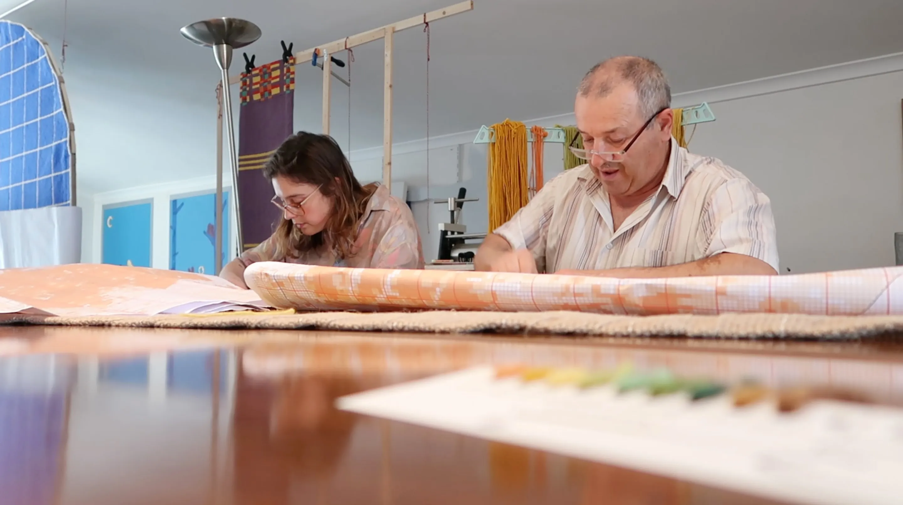 Two people working together on HELIA during the residency production process.