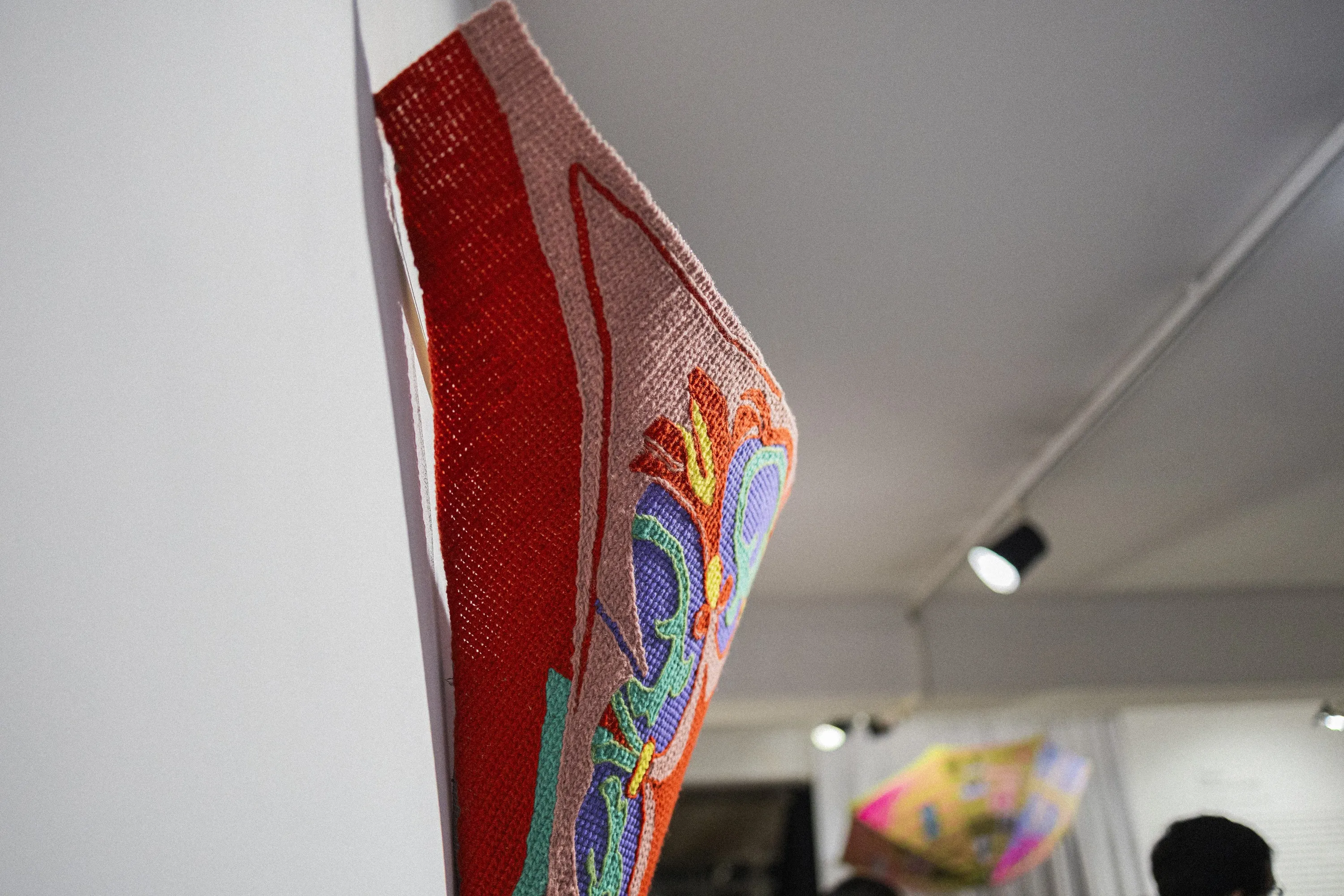 Detail of a suspended textile work in ÁGORA