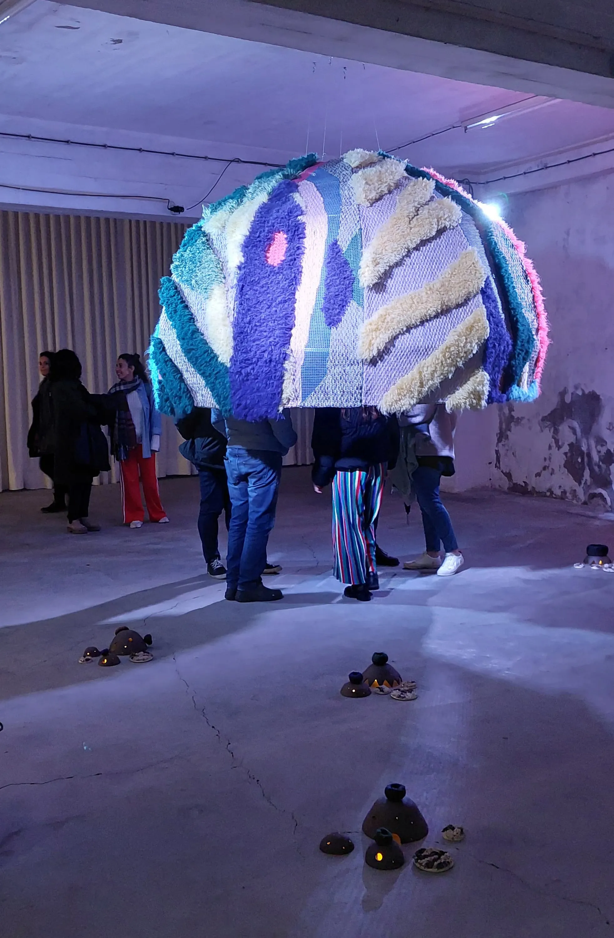 AURORA installed as a large textile dome in the exhibition space.