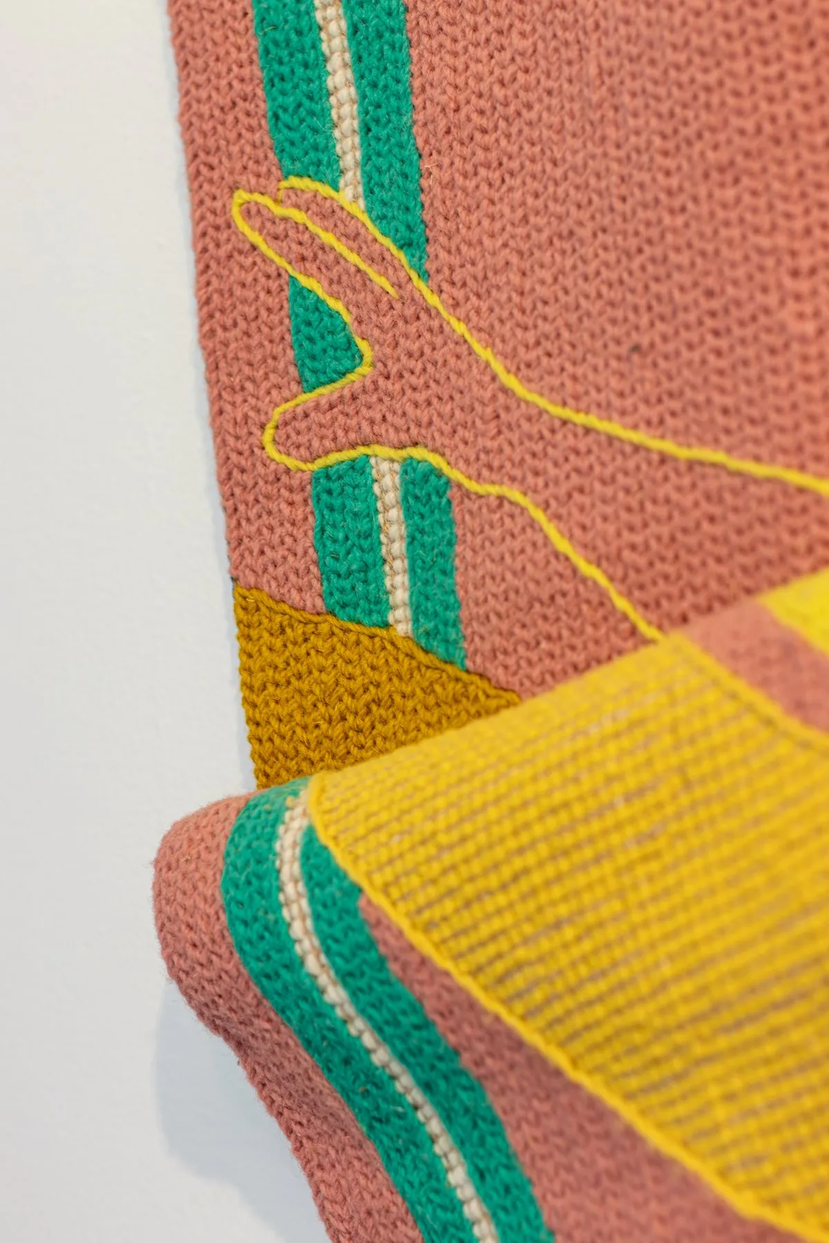 Detail of the hand and folded edge in HIDE & SEEK by Susana Cereja